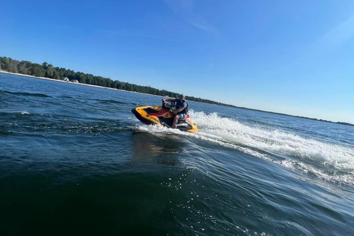 a man riding a wave on top of a body of water