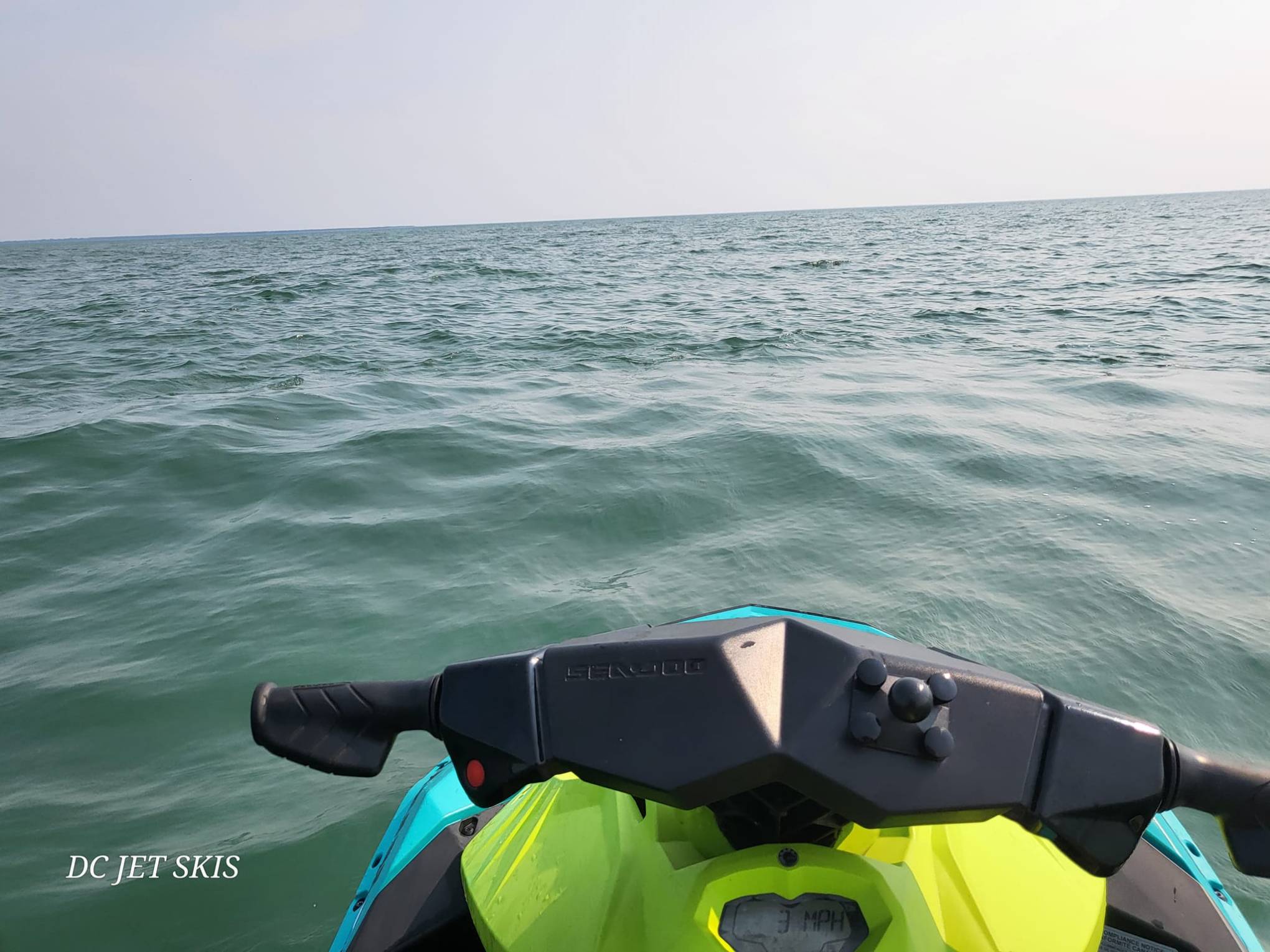 a person standing next to a body of water
