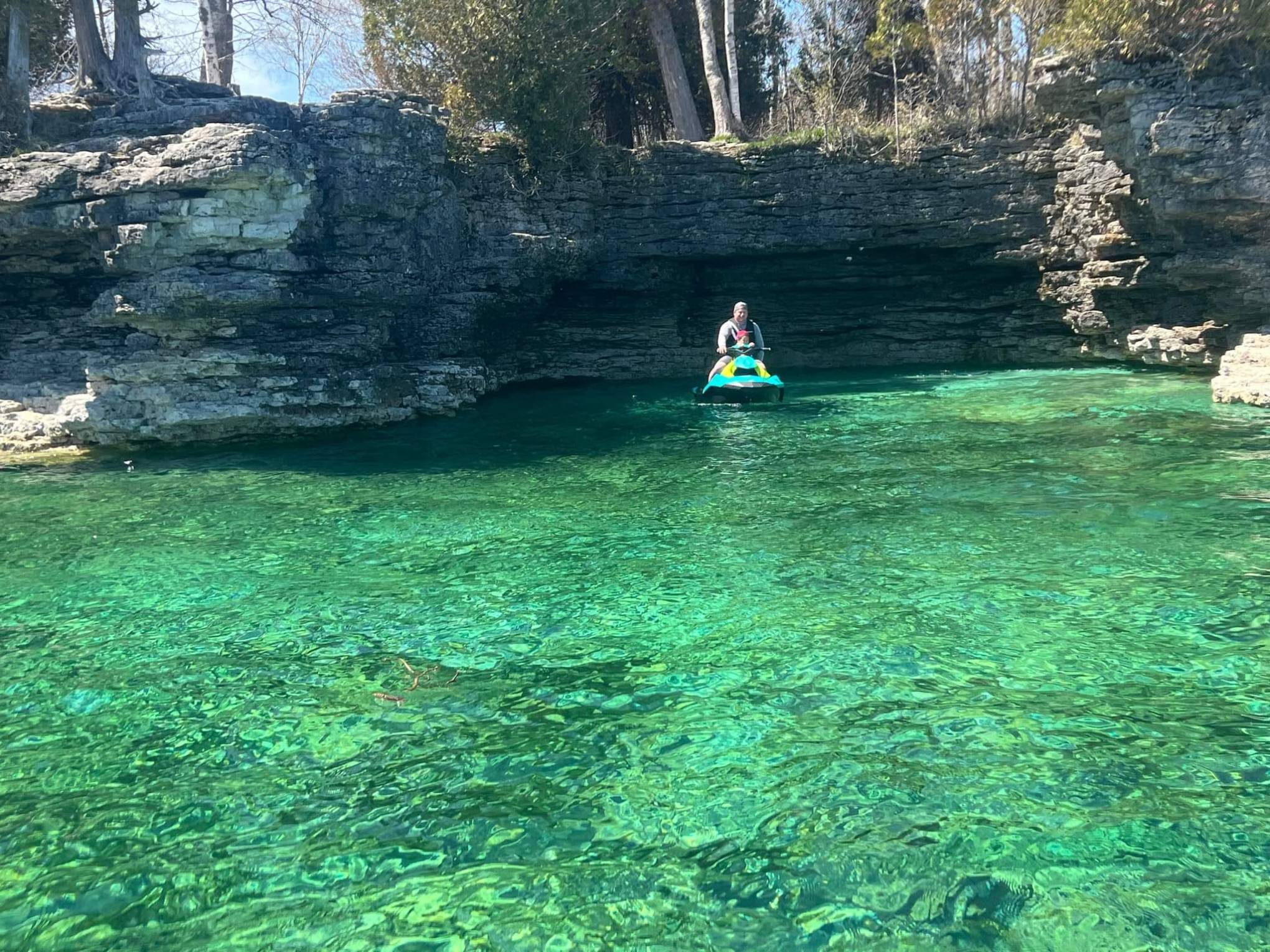 a group of blue and green water