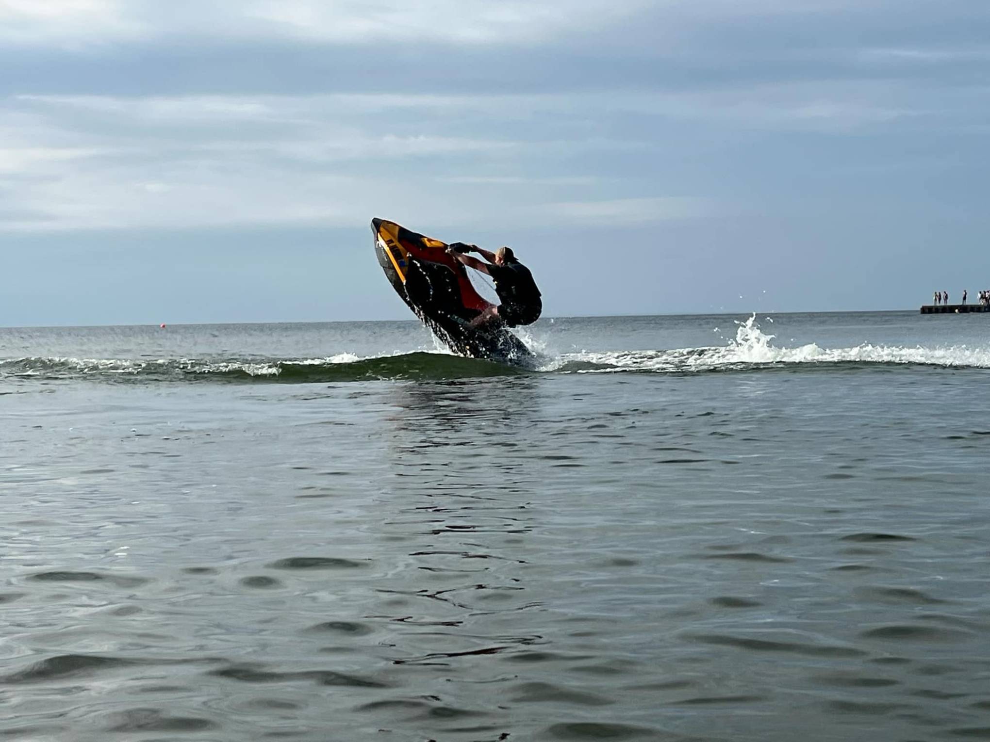 a person riding a surf board on a body of water