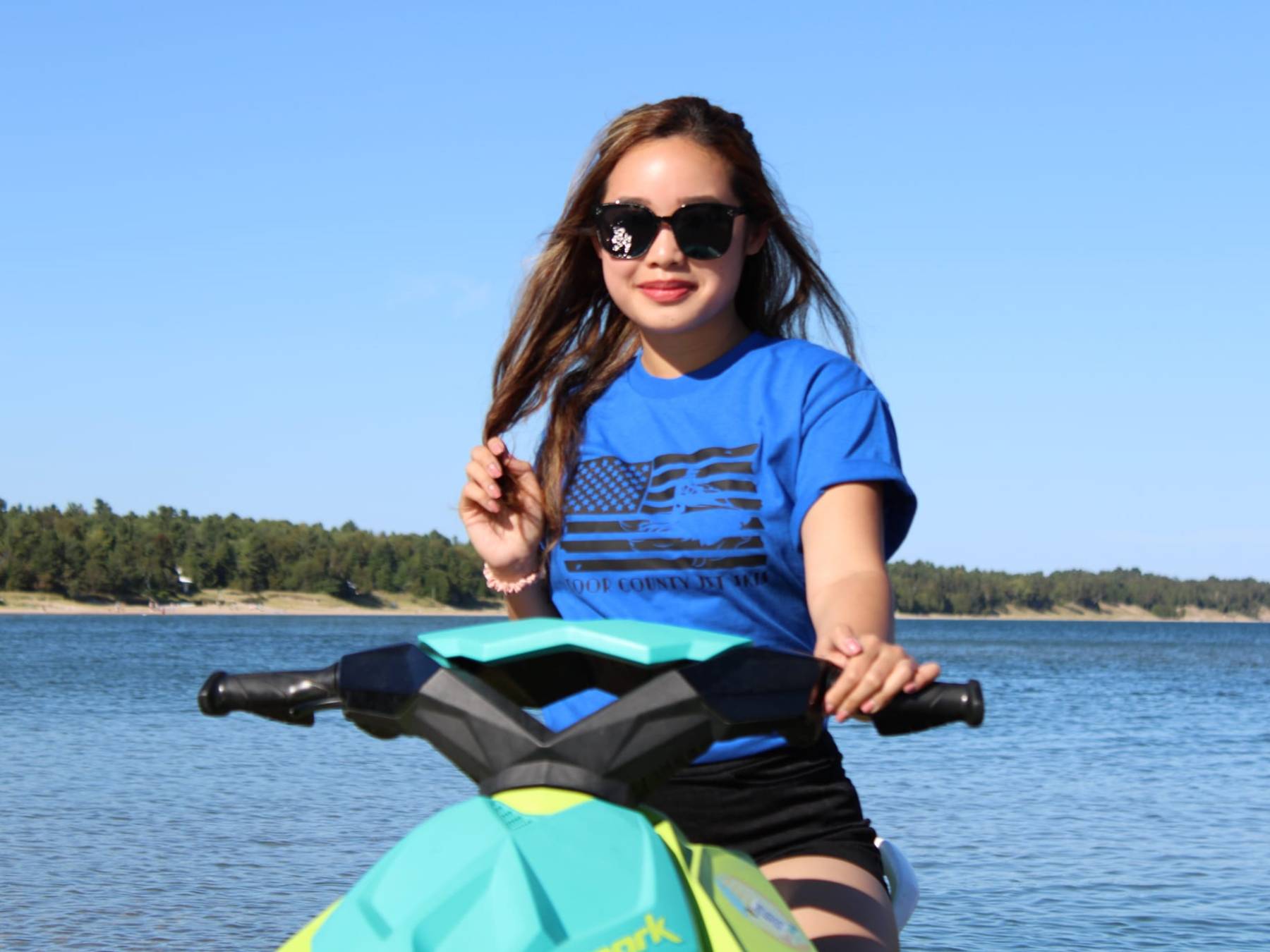 a person sitting next to a body of water